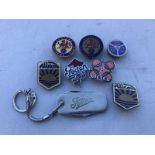 A Foden penknife and various lapel badges advertising commercial vehicles.