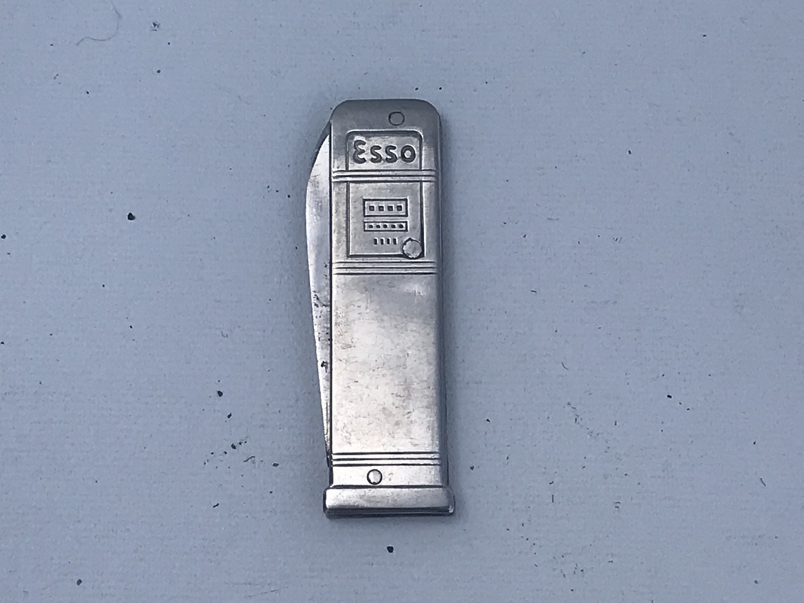 A penknife in the form of an Esso branded 1960s petrol pump.