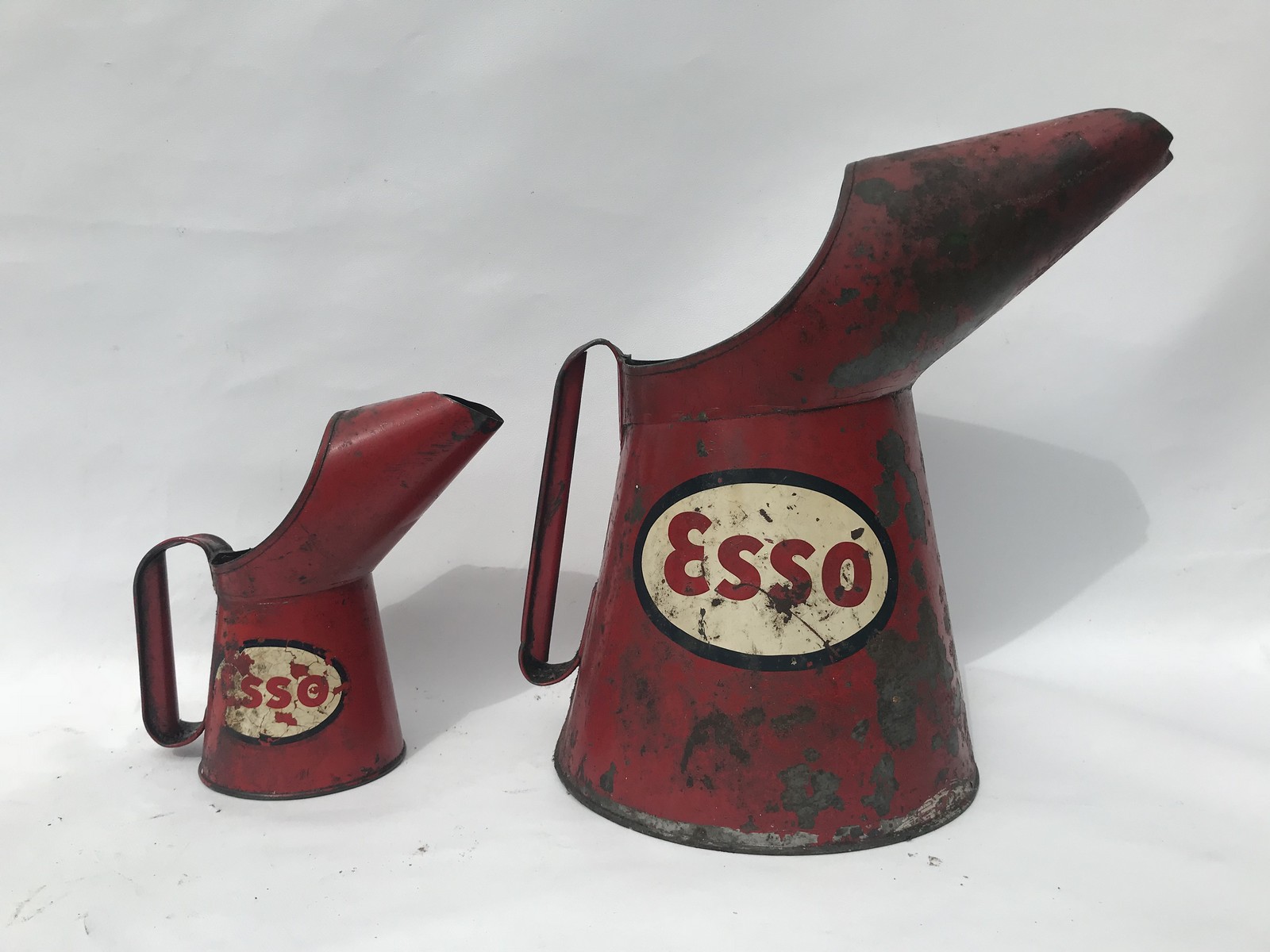 An Esso gallon oil measure and a matching pint measure.