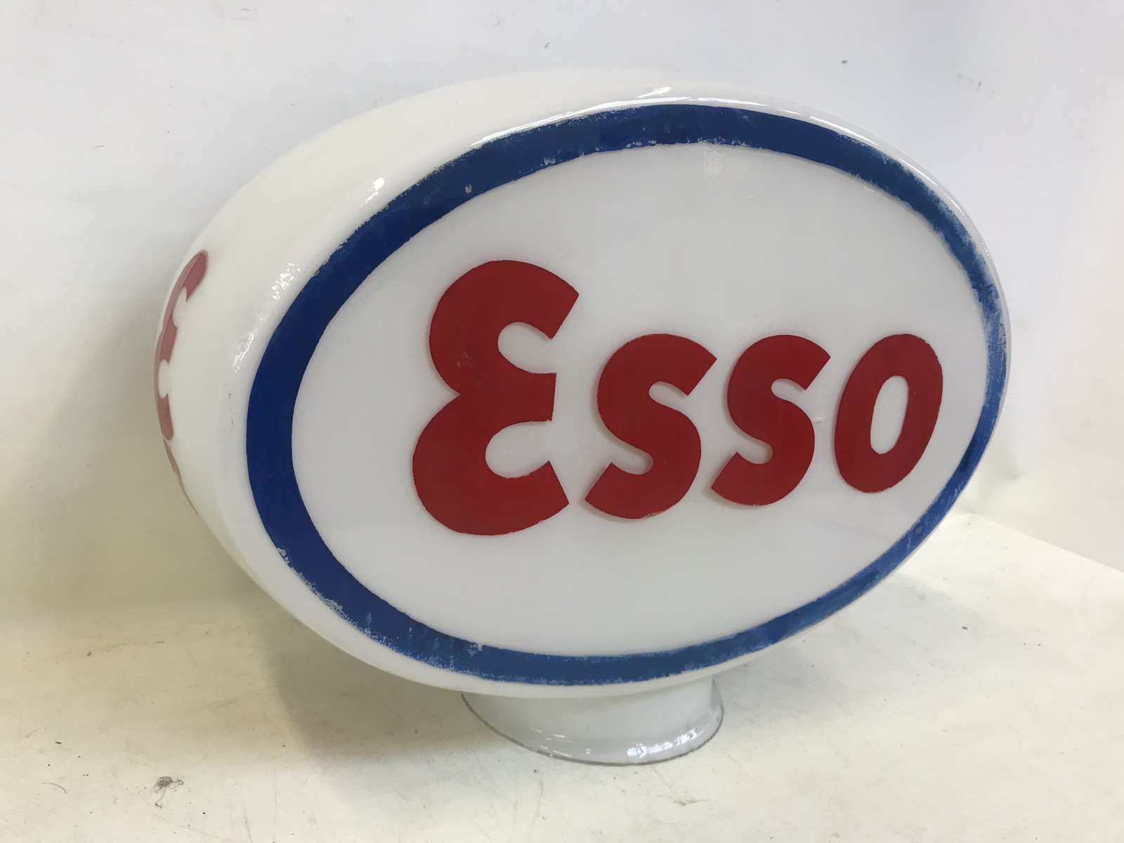 An Esso oval glass petrol pump globe.