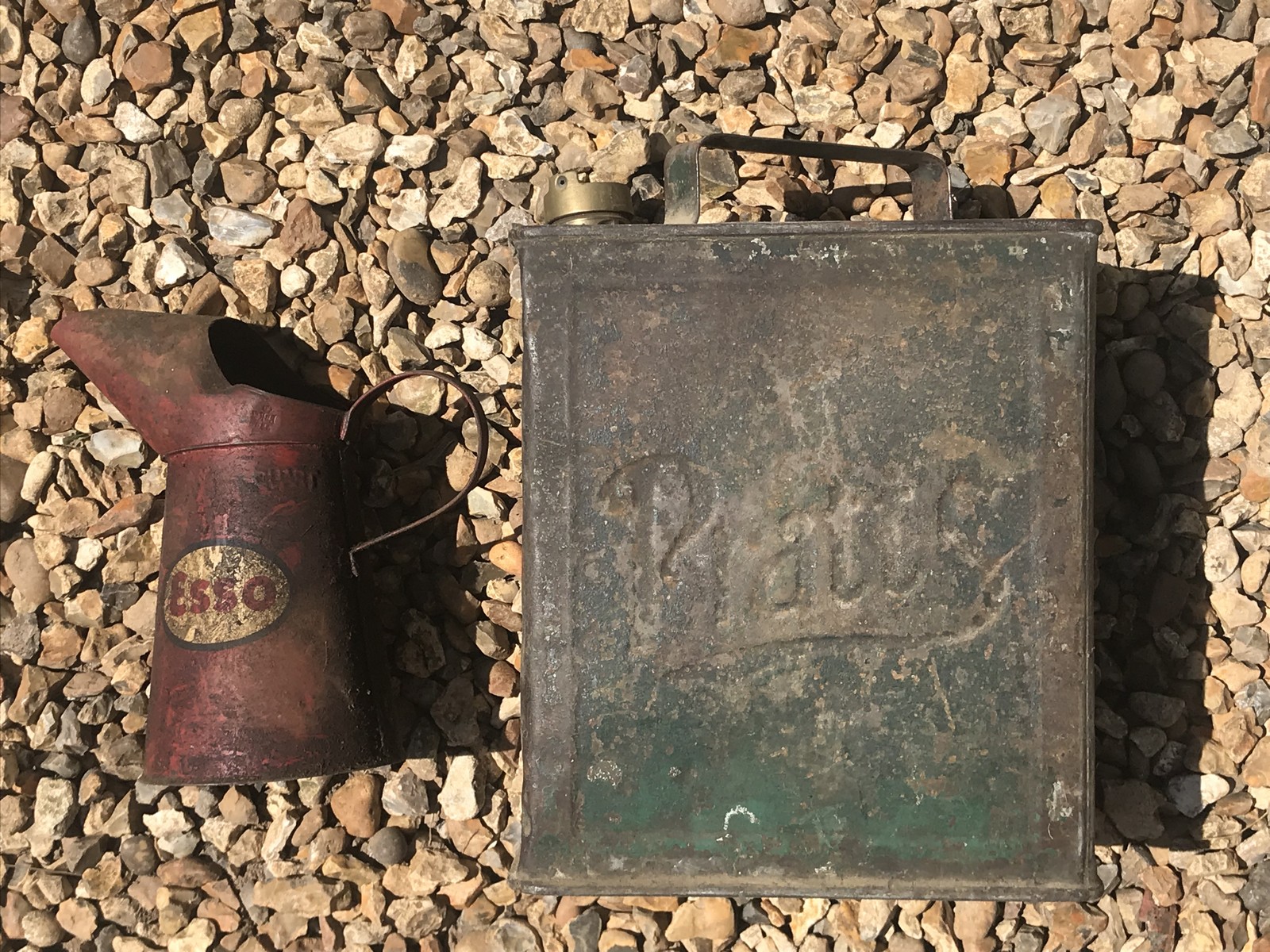 A Pratts two gallon petrol can and an Esso oil measure.