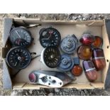 A box of assorted Jaguar instruments to include a speedometer and three rev. counters.