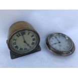 A Smiths eight day car clock, brass bodied and display base mounted and one other.