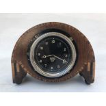 A Smiths black faced eight day car clock, rear wind, mounted for display, by repute overhauled and