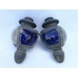 A pair of Auteroche opera lamps with star-cut blue lenses (one cracked).