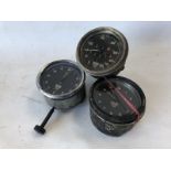 A Smiths black faced 0-80mph speedometer and two clocks.