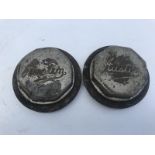 Two large and early Austin hub caps.