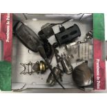 A box of assorted parts to include an adjustable spotlamp, an oil can etc.