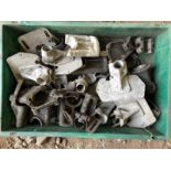 A crate of assorted steering column brackets etc.