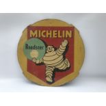 A Michelin Roadster hardboard tyre insert advertising sign depicting Mr. Bibendum, 24 1/2"