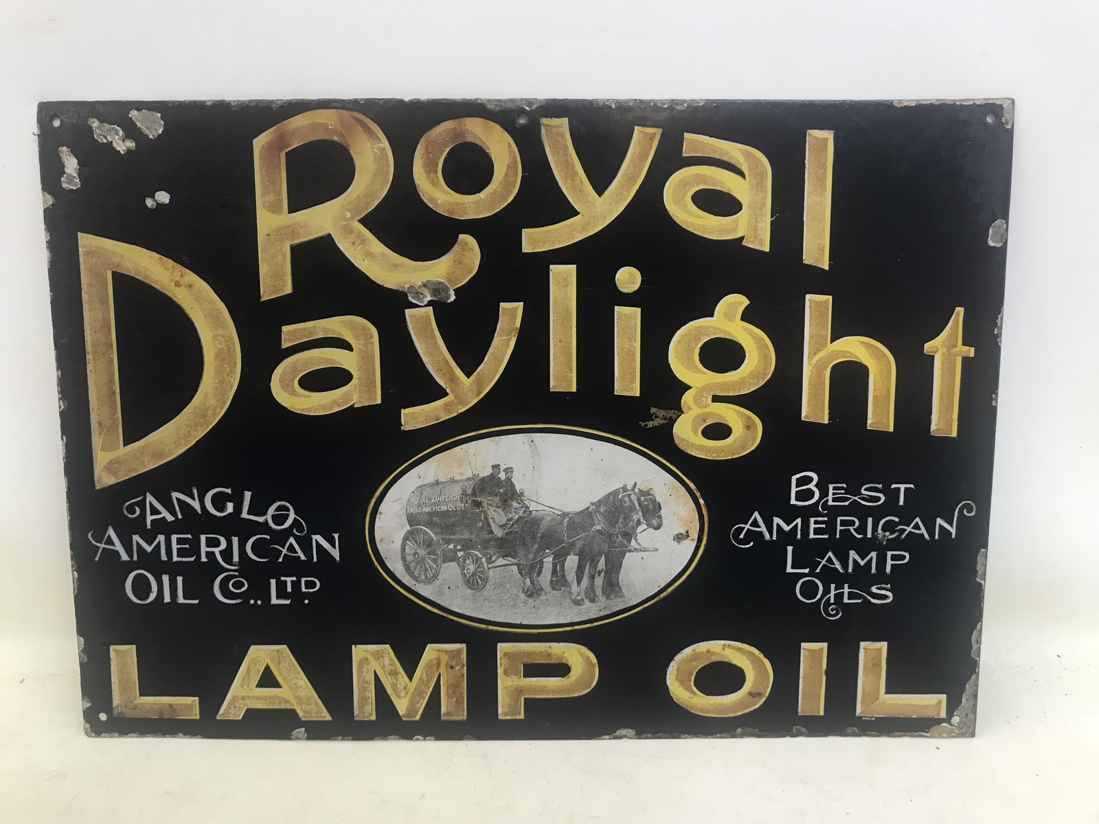 A Royal Daylight Lamp Oil part pictorial enamel sign with central image of a horse drawn tanker,