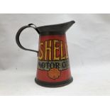 An early Shell Motor Oil quart oil measure.