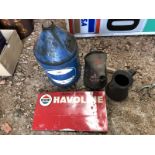A Regent Havoline tin sign, two oil measures and a Regent five gallon pyramid can.