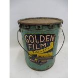 A Golden Film Lubricants cylindrical lidded pot.