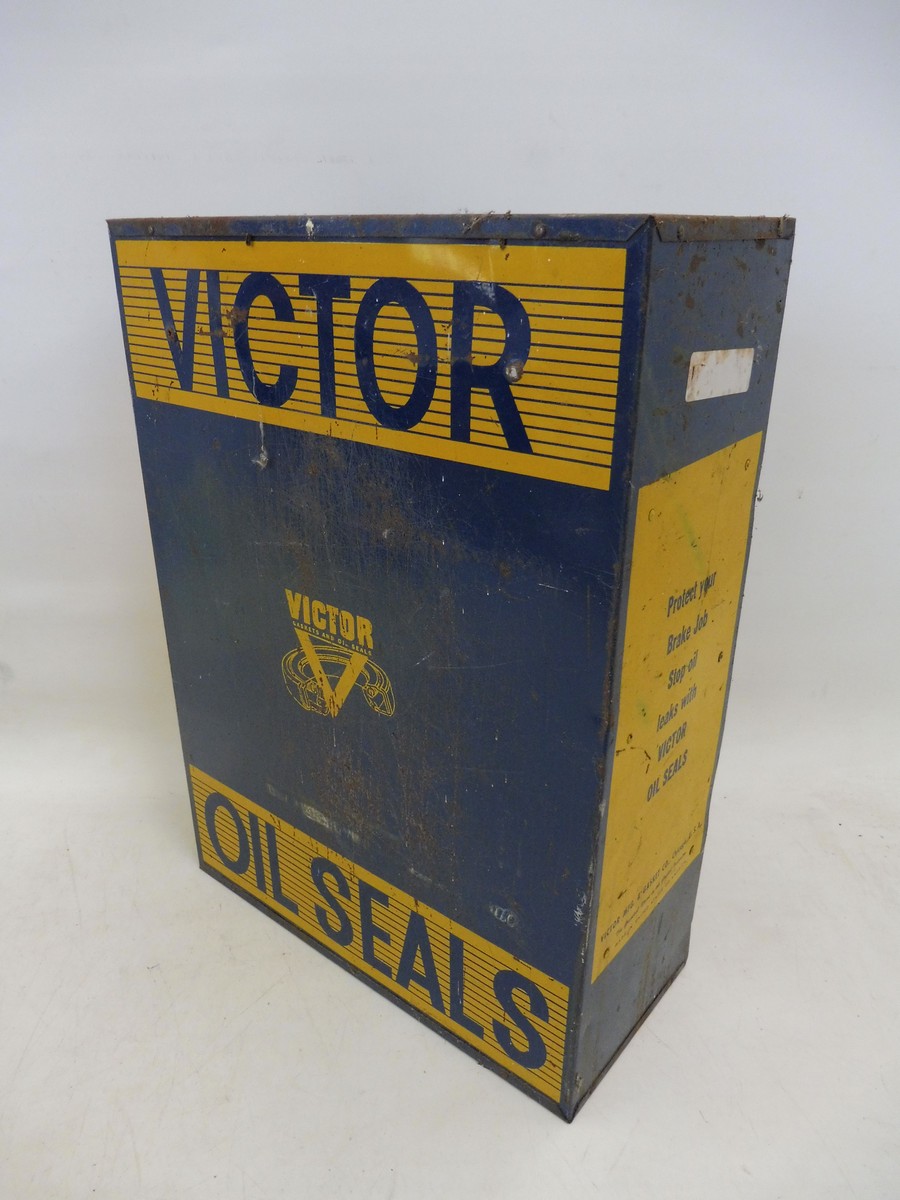 A Victor Oil Seals counter top dispensing shelf, 15 1/4" wide x 21" high x 7" deep.