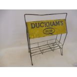 A Duckham's 20-50 forecourt oil bottle/tin rack.