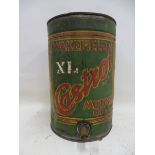 A Wakefield Castrol Motor Oil five gallon embossed drum with brass dispensing tap.