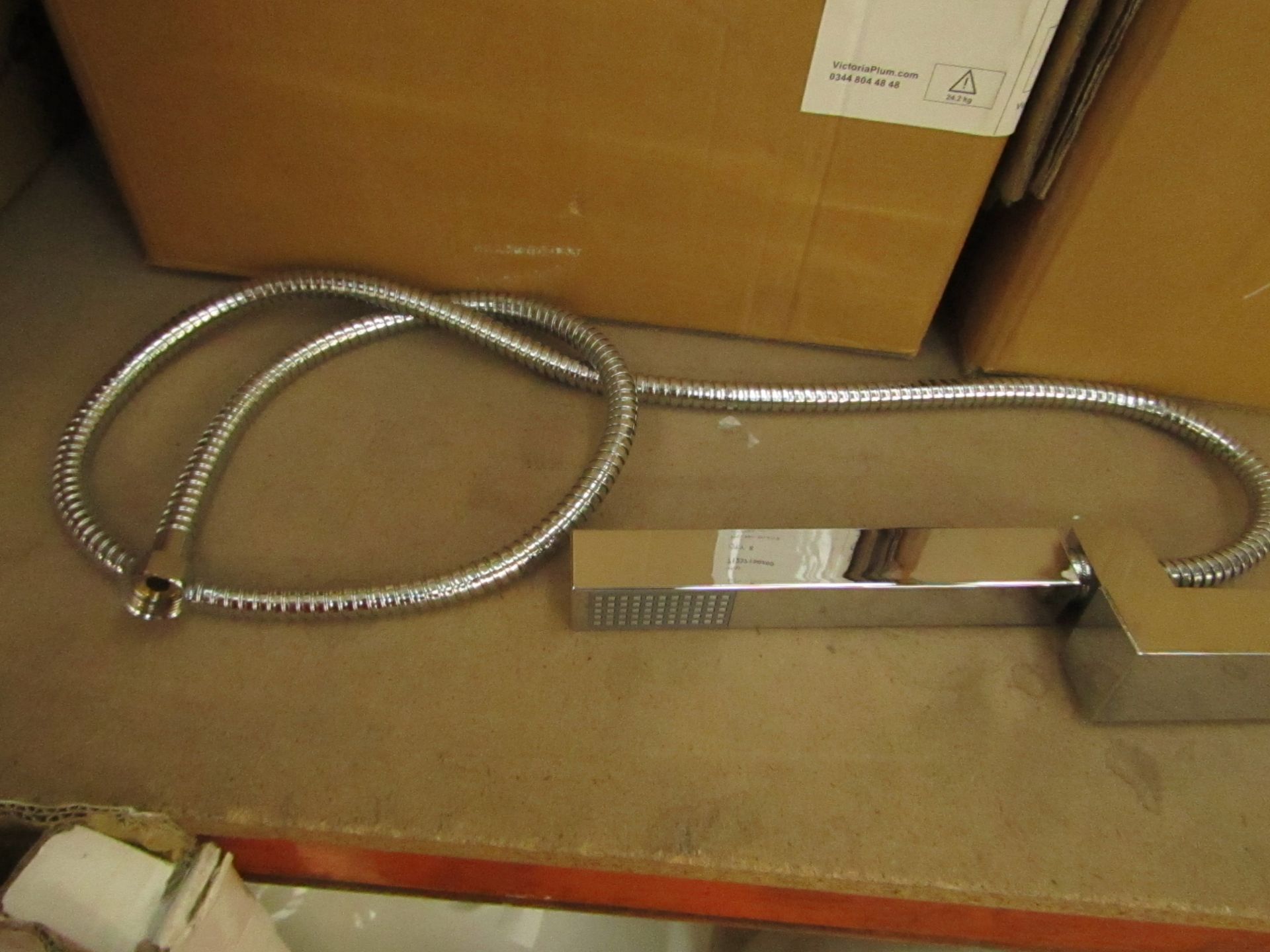 Square hand shower head with wall bracket & shower hose. All new in packaging.