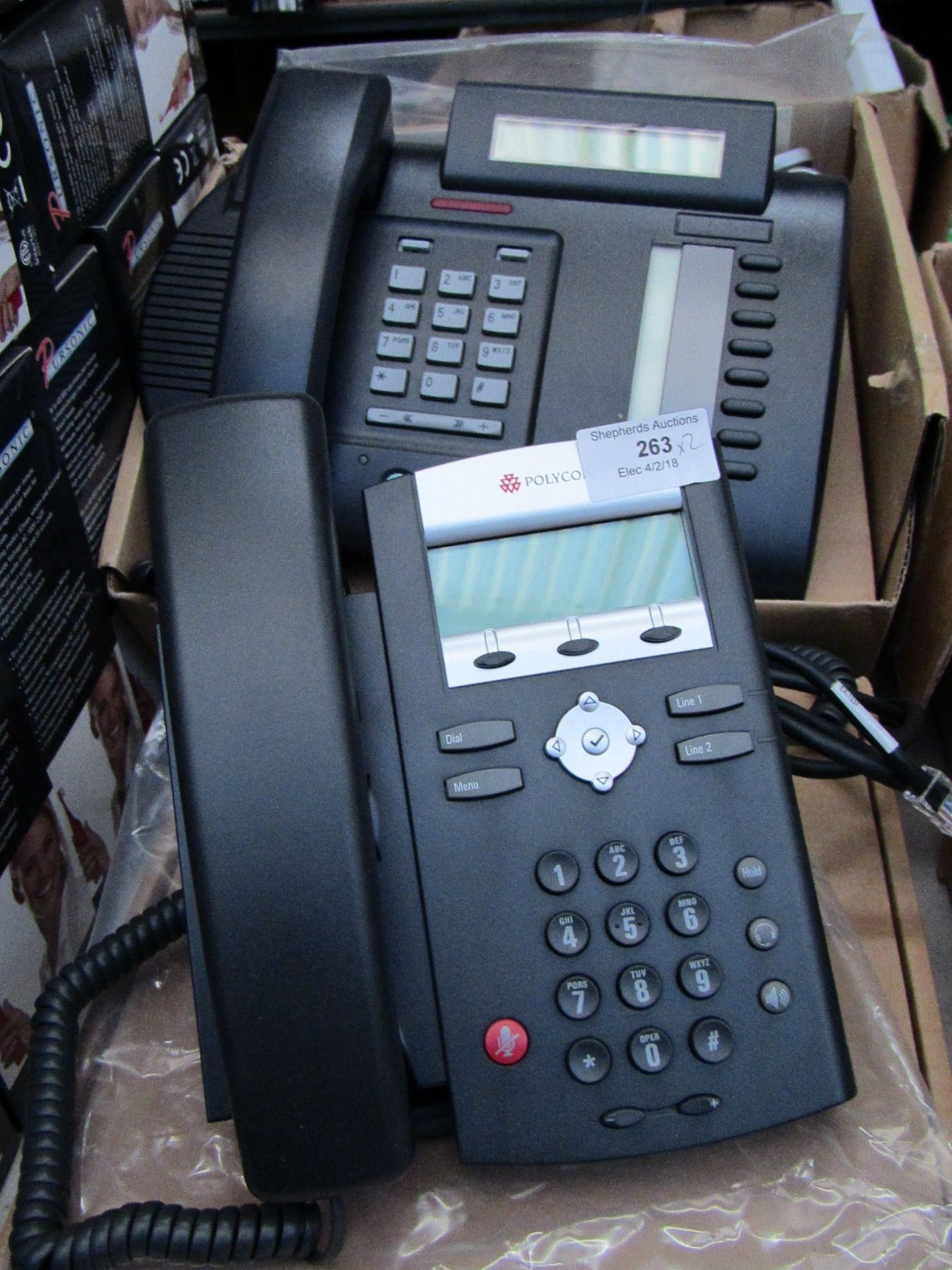 2x office telephones. Untested and boxed.