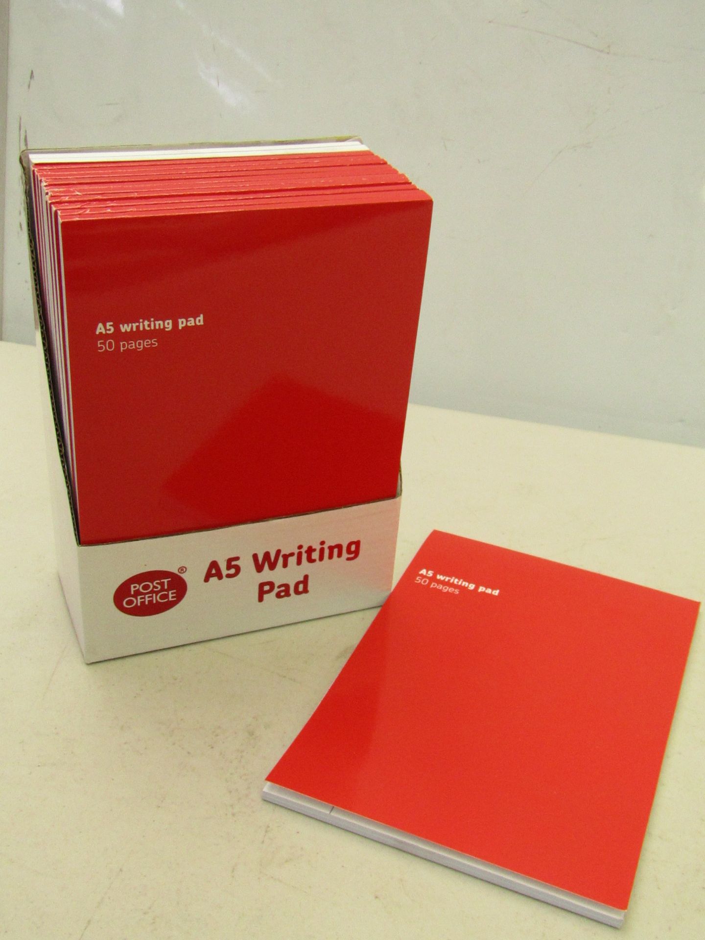 3x boxes of Post Office A5 writing pads. Each box contains 12x writing pads, each pad contains 50