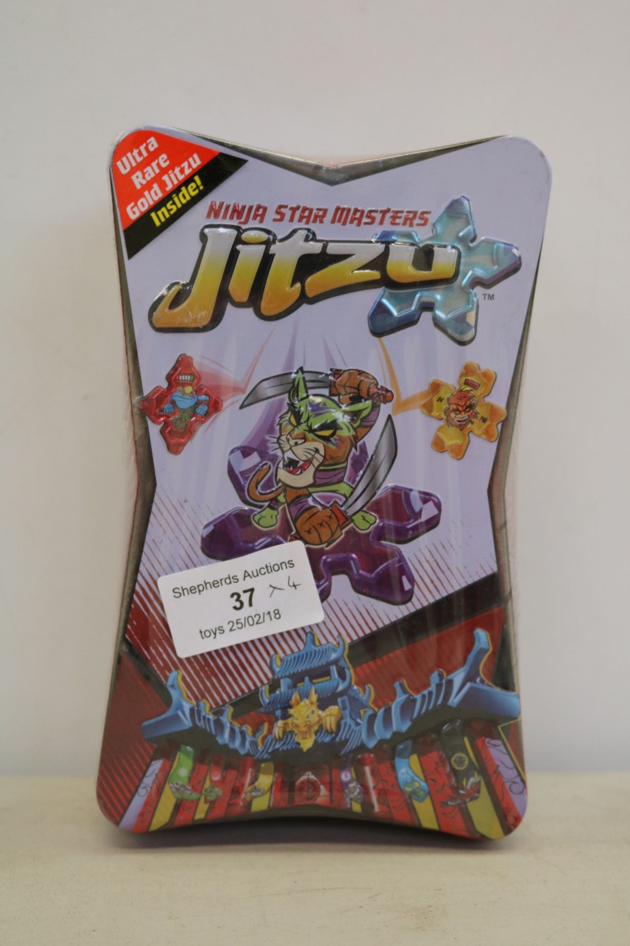 4x Jitzu ninja star masters, new and factory sealed in tin box.