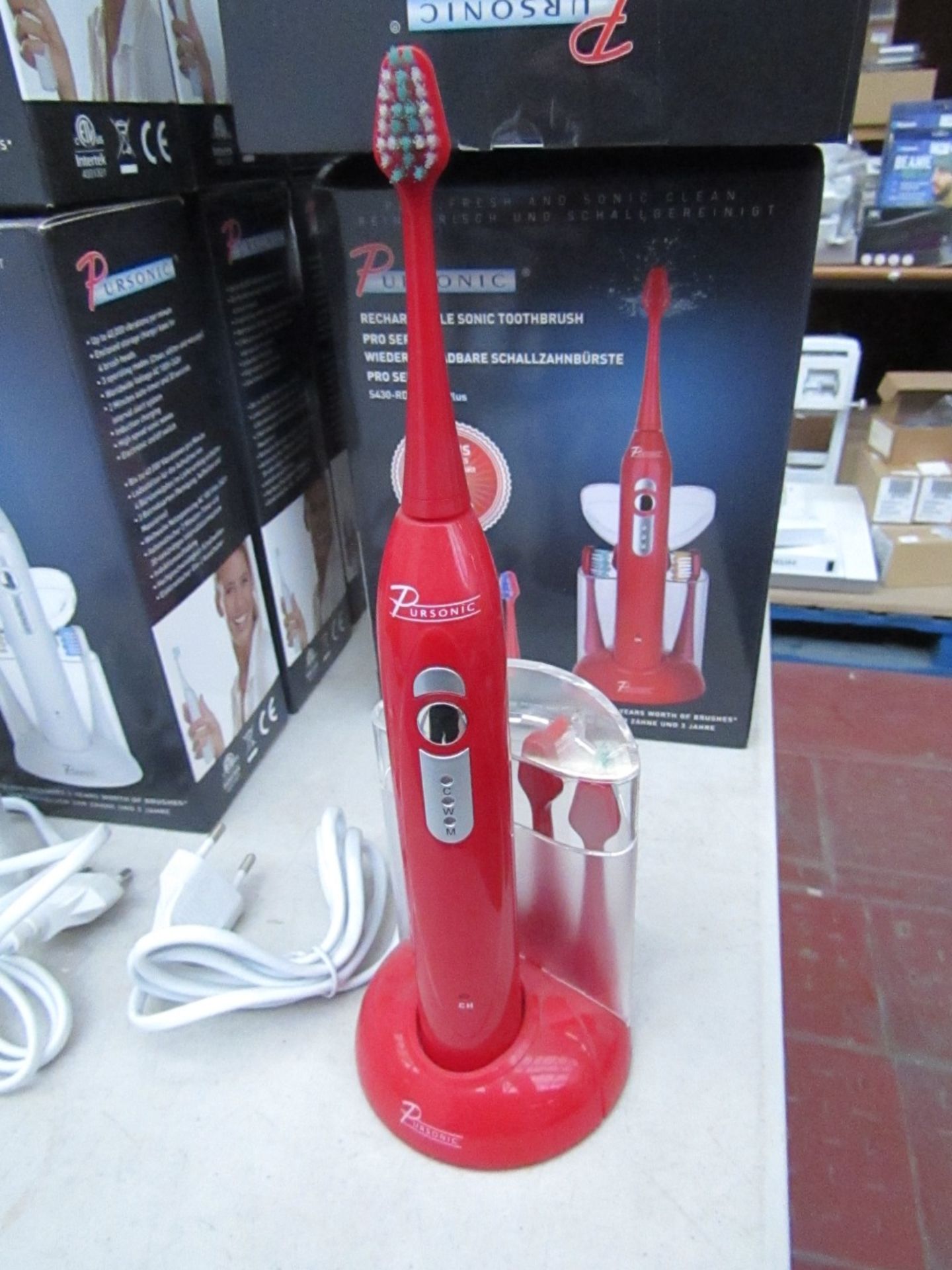 Pursonic Pro Series rechargeable sonic red coloured toothbrush including 3 years worth of brush