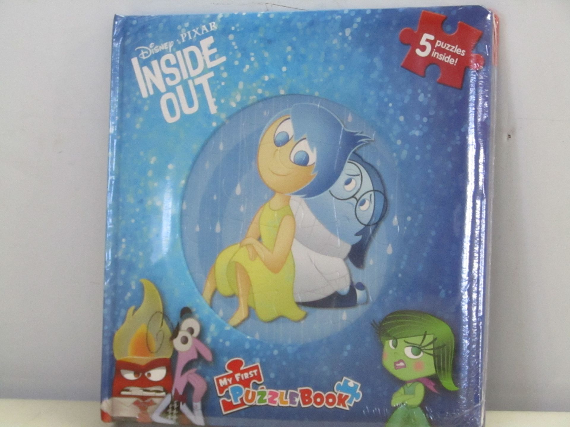 Box containing 12x Disney Pixar Inside Out Puzzle Books. New and boxed.