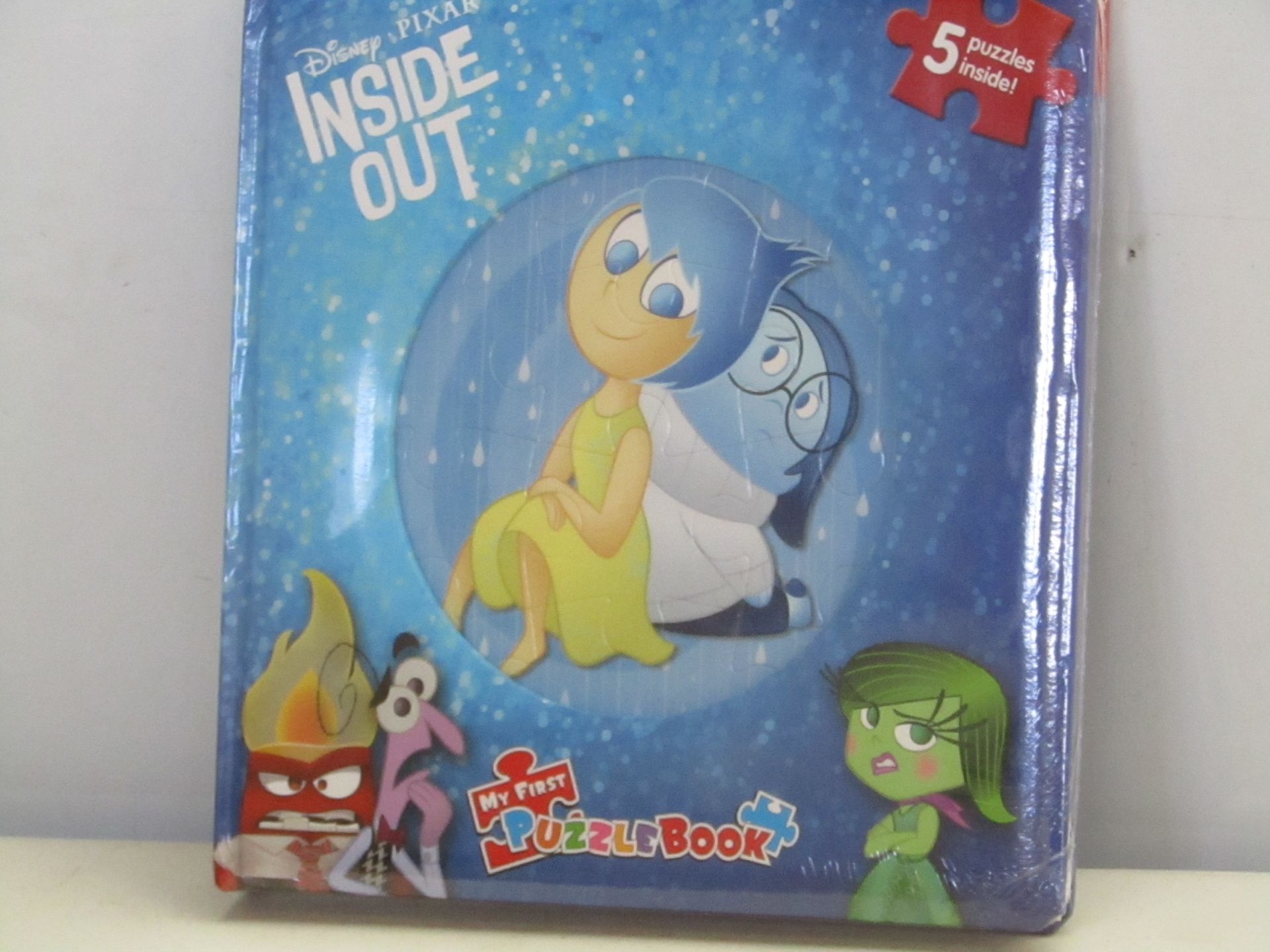 Box containing 12x Disney Pixar Inside Out Puzzle Books. New and boxed.