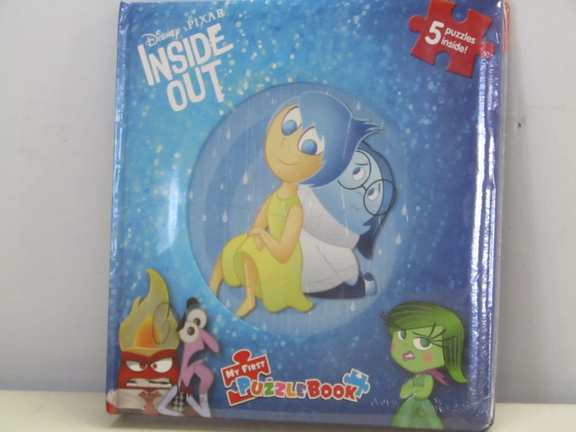 Box containing 12x Disney Pixar Inside Out Puzzle Books. New and boxed.