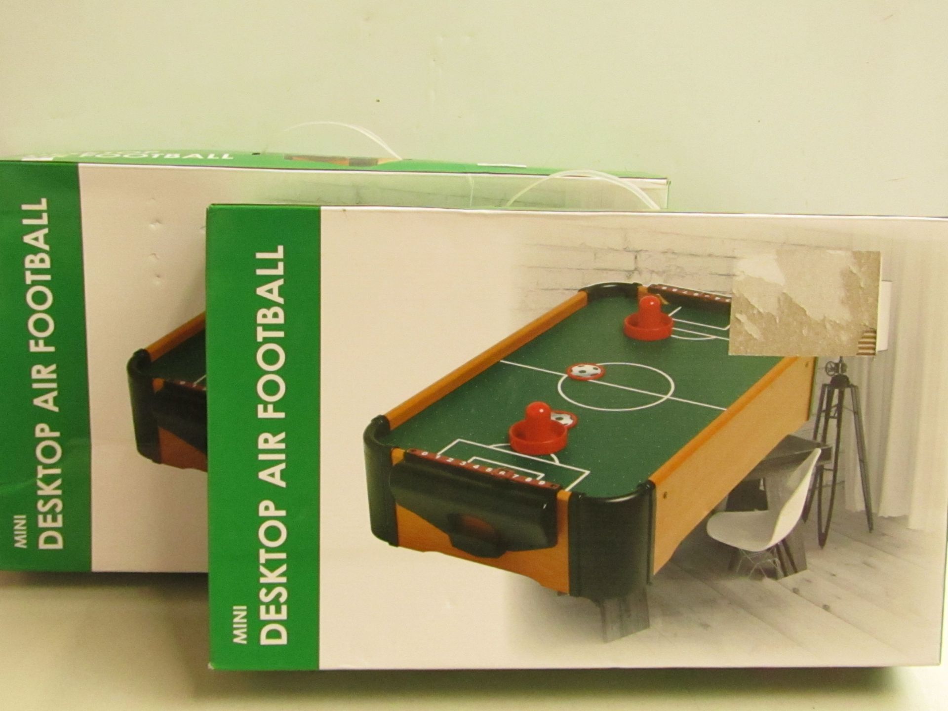 2x mini desktop air football, unchecked and boxed.