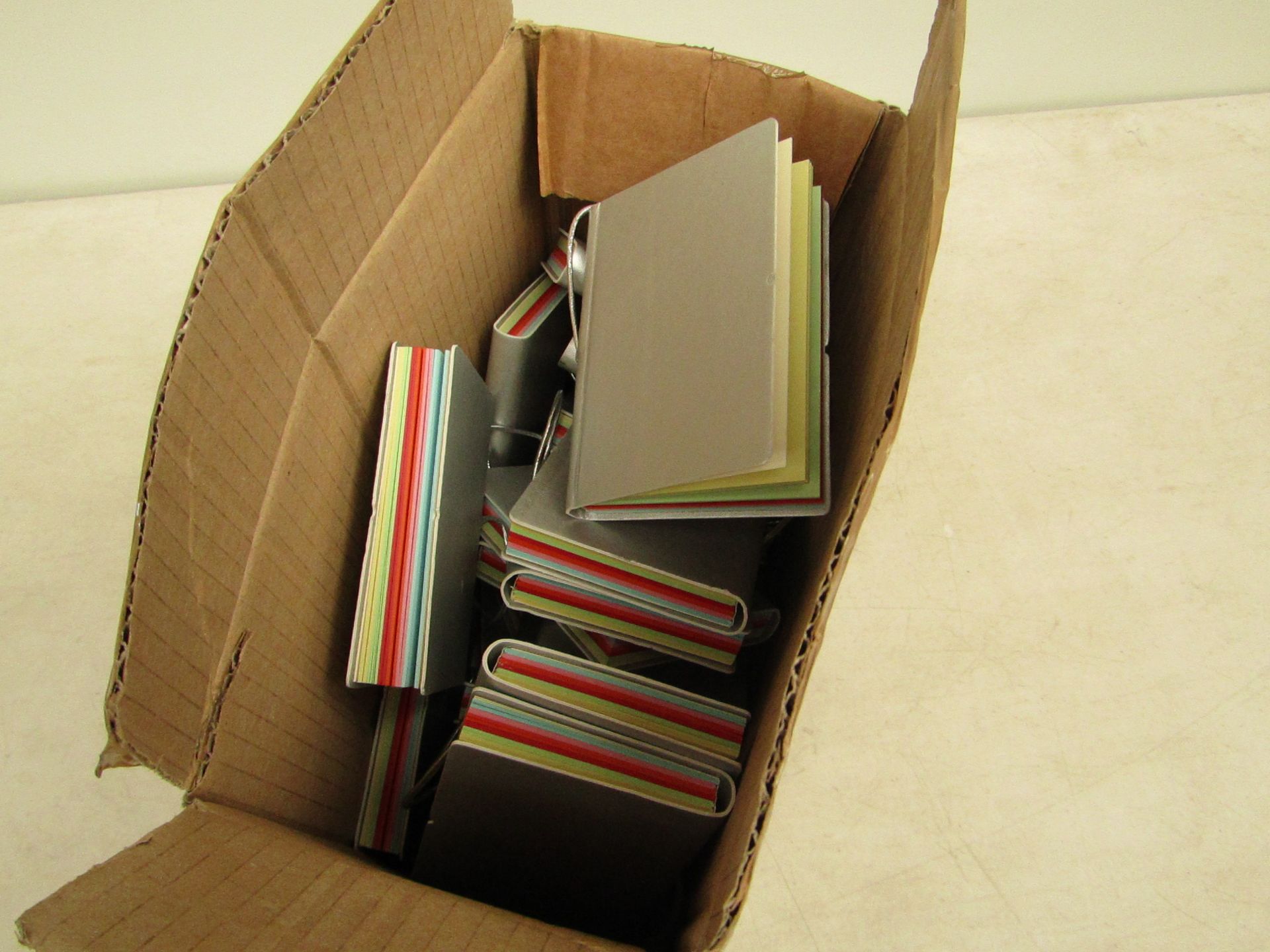 Box of approximately 100x, Mini A7 note books, new.