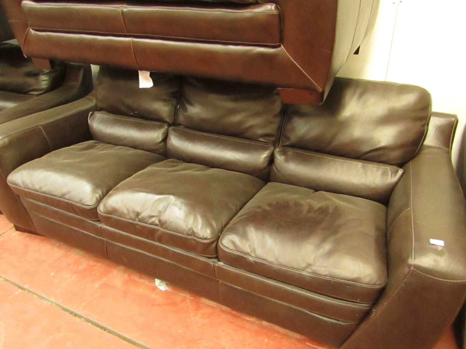 Brown leather 3 seater sofa with no visible damage.