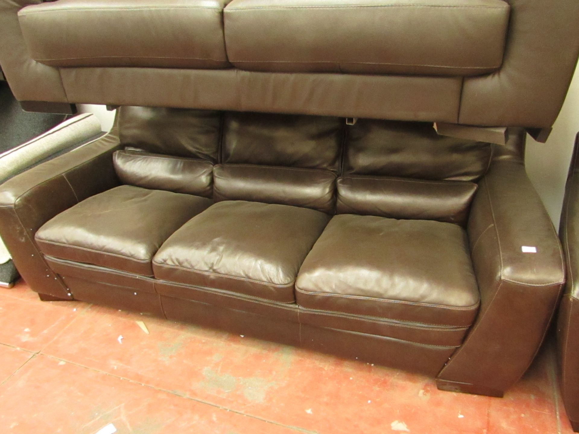 Brown leather 3 seater sofa with no visible damage.