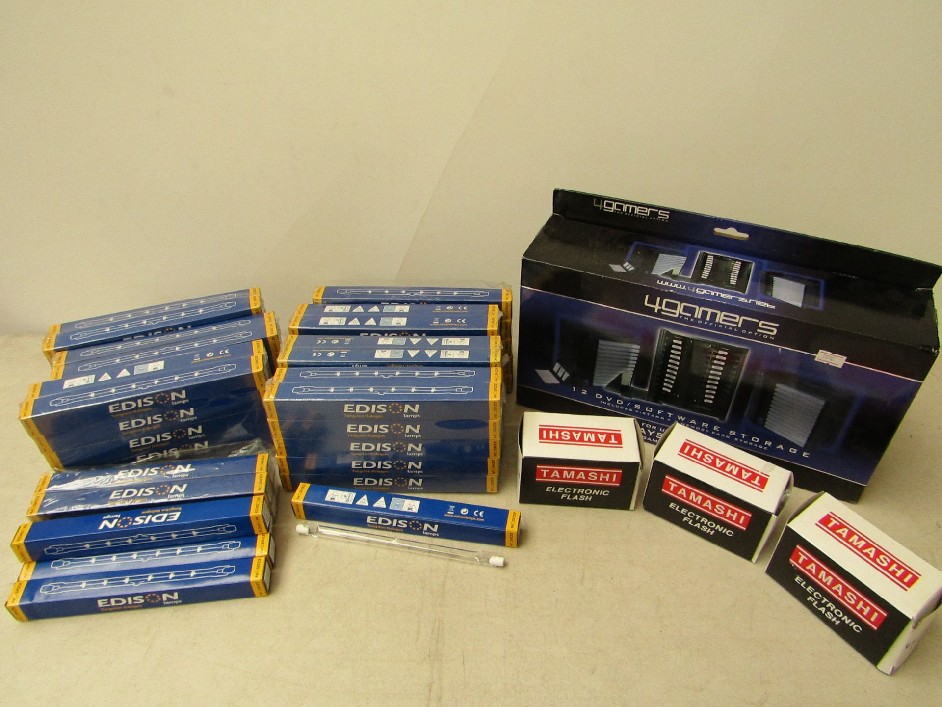 Box containing approx 60x tungsten halogen bulbs, 3x electronic flashes, untested, 12 dvd/software