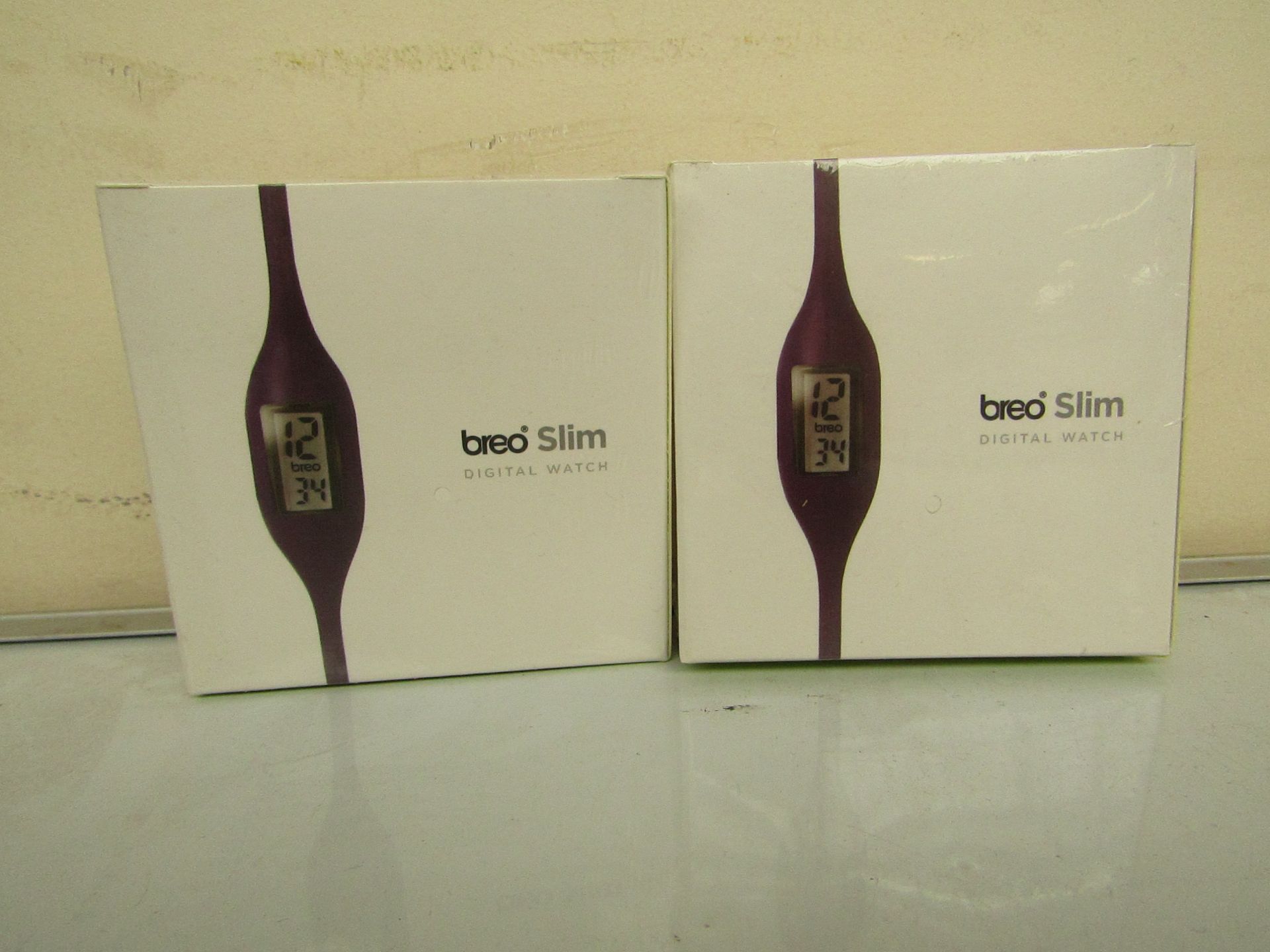 2x Breo Slim digital watches, still sealed in the boxes