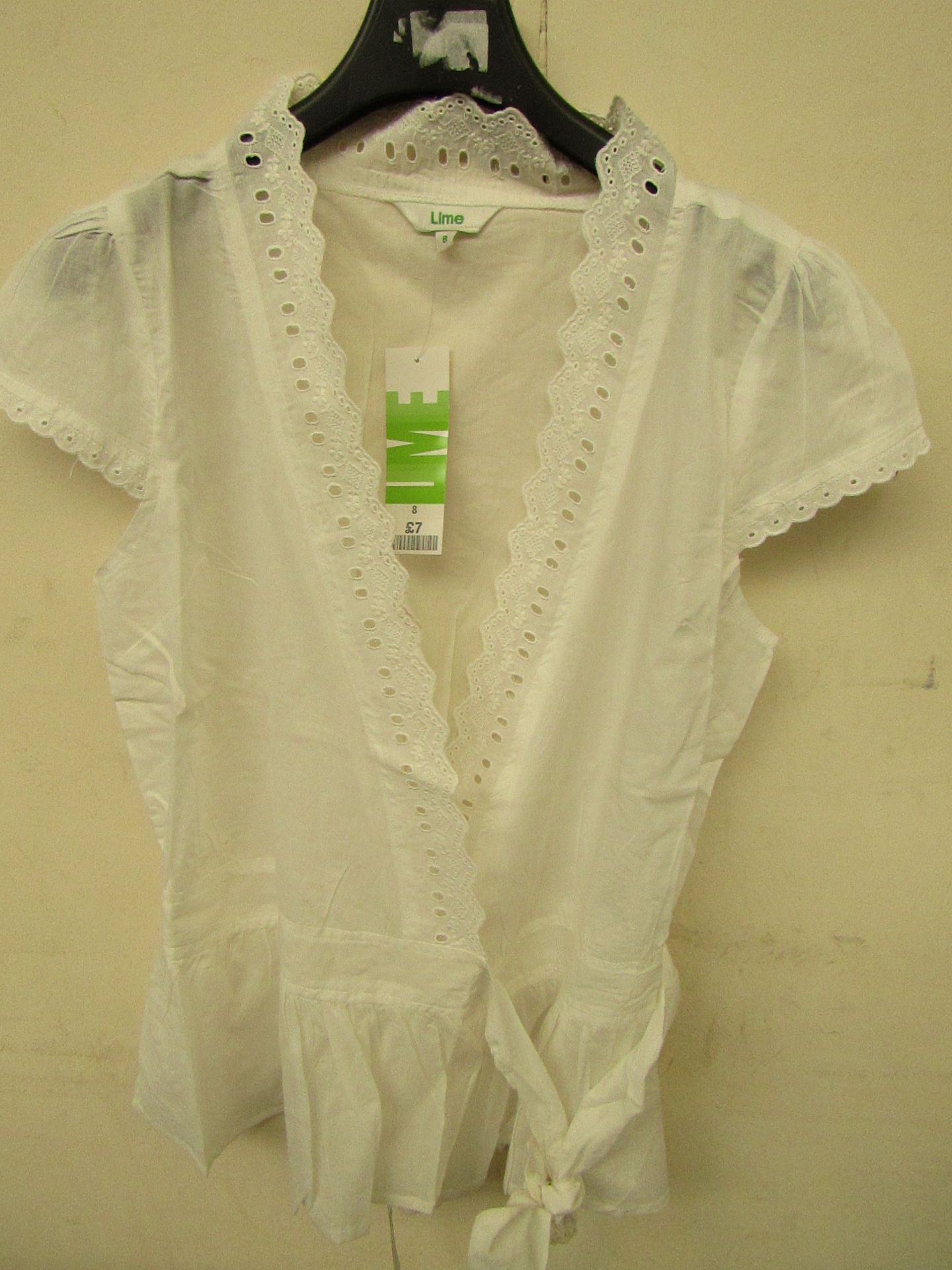 35 X Ladies 100% cotton tie fronted tops,cream sizes range from 8-16 all new in packaging