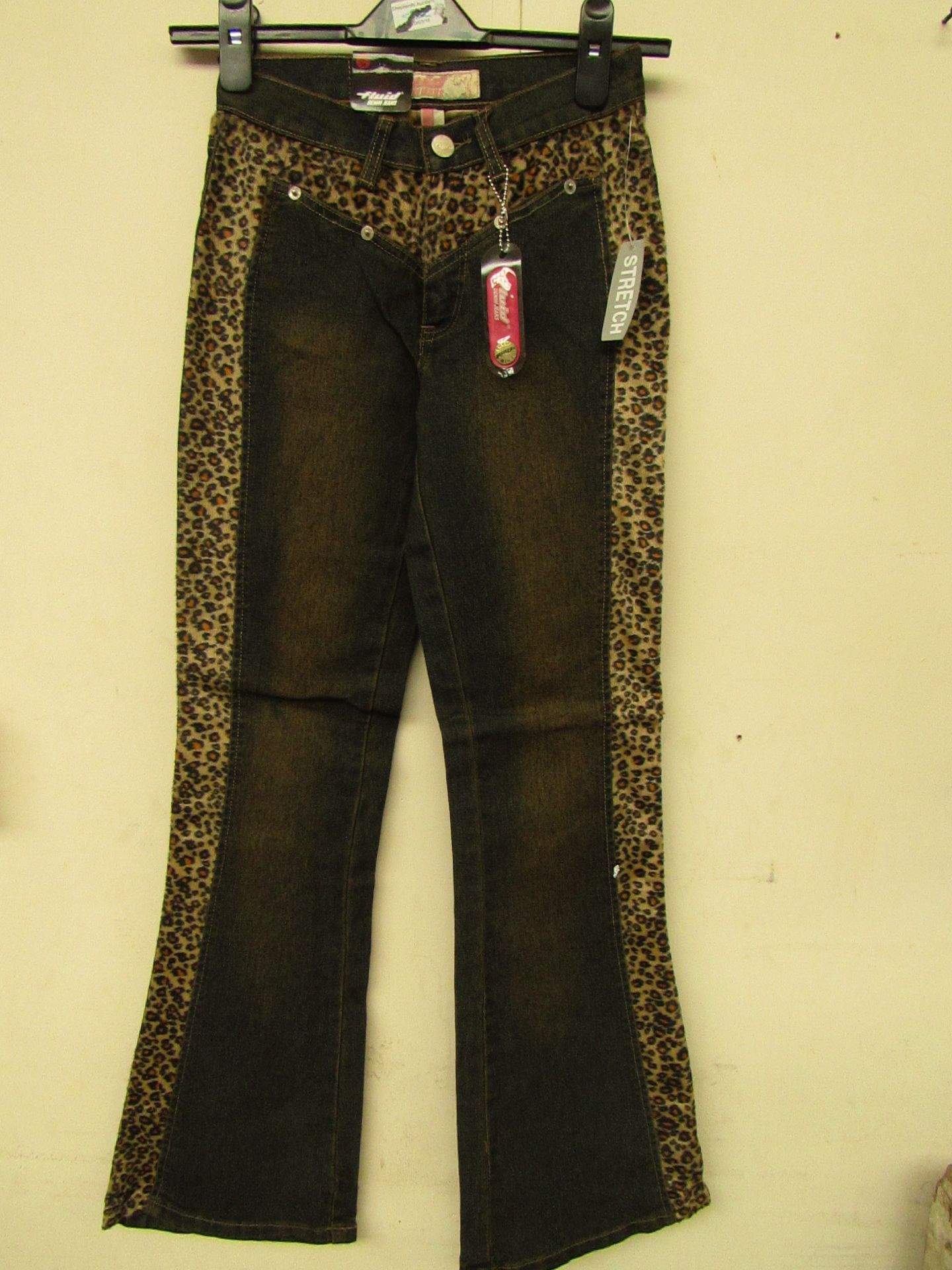 8 Pairs of girls stretch jeans with lepoard print design,various sizes range from 7yrs to 13 yrs,all