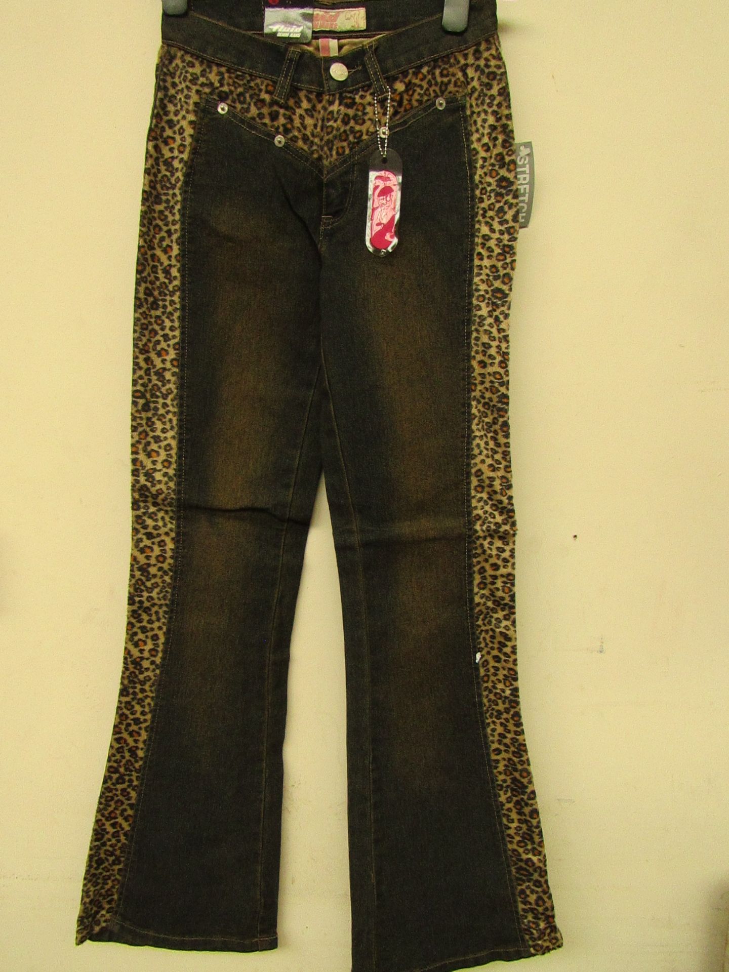 9 Pairs of girls stretch jeans with lepoard print design,various sizes range from 7yrs to 13 yrs,all