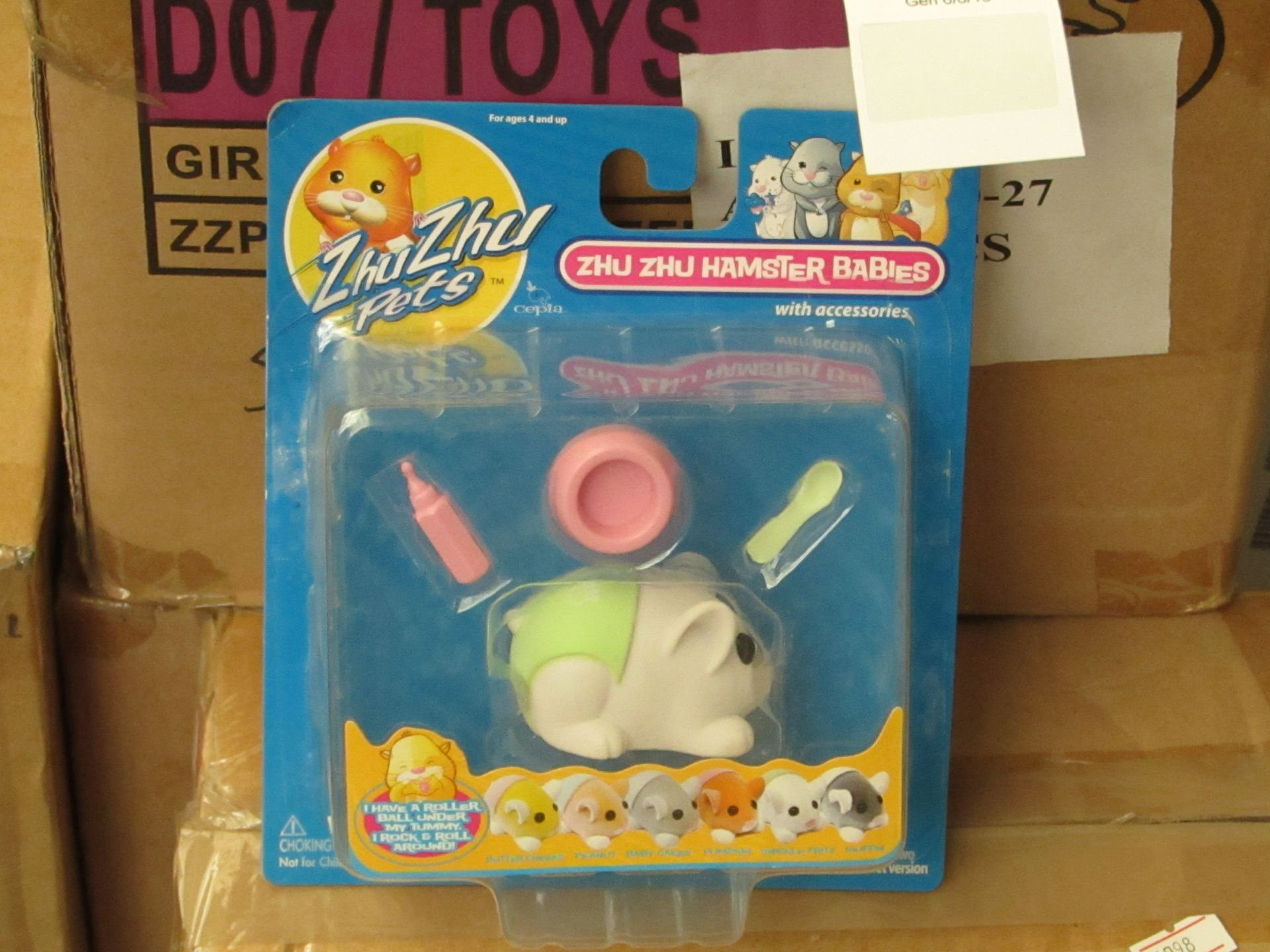 Box of 8x Zhu Zhu pets, new and packaged.