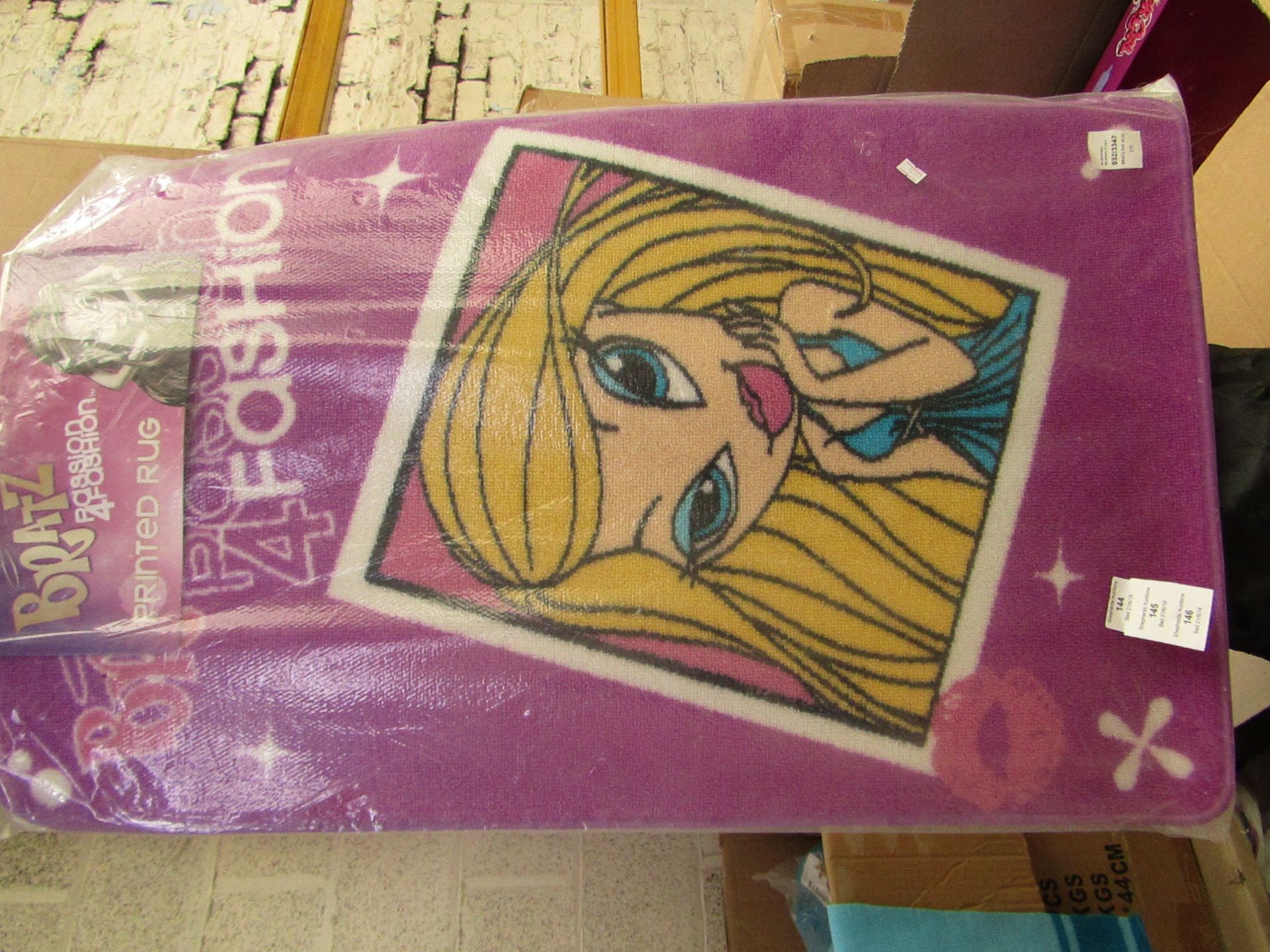 Bratz printed rug, 57cm x 90cm, new in packaging.