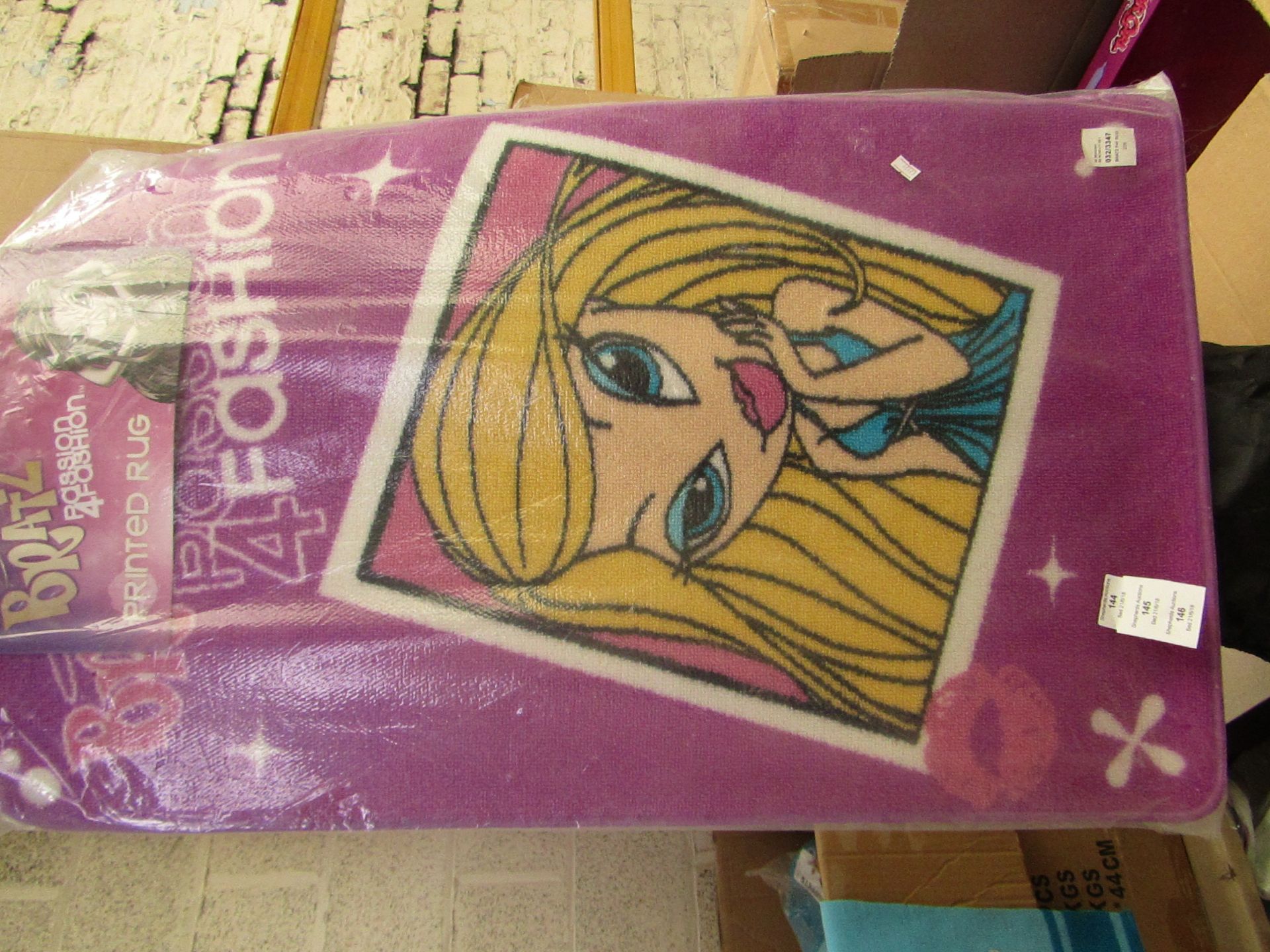 Bratz printed rug, 57cm x 90cm, new in packaging.