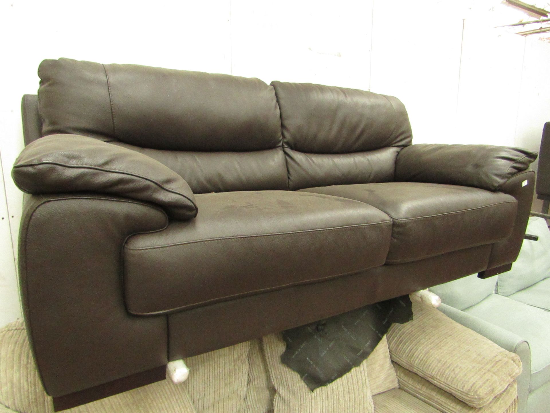 International contemporary designs Leather 2 seater sofa, no visible damage found.
