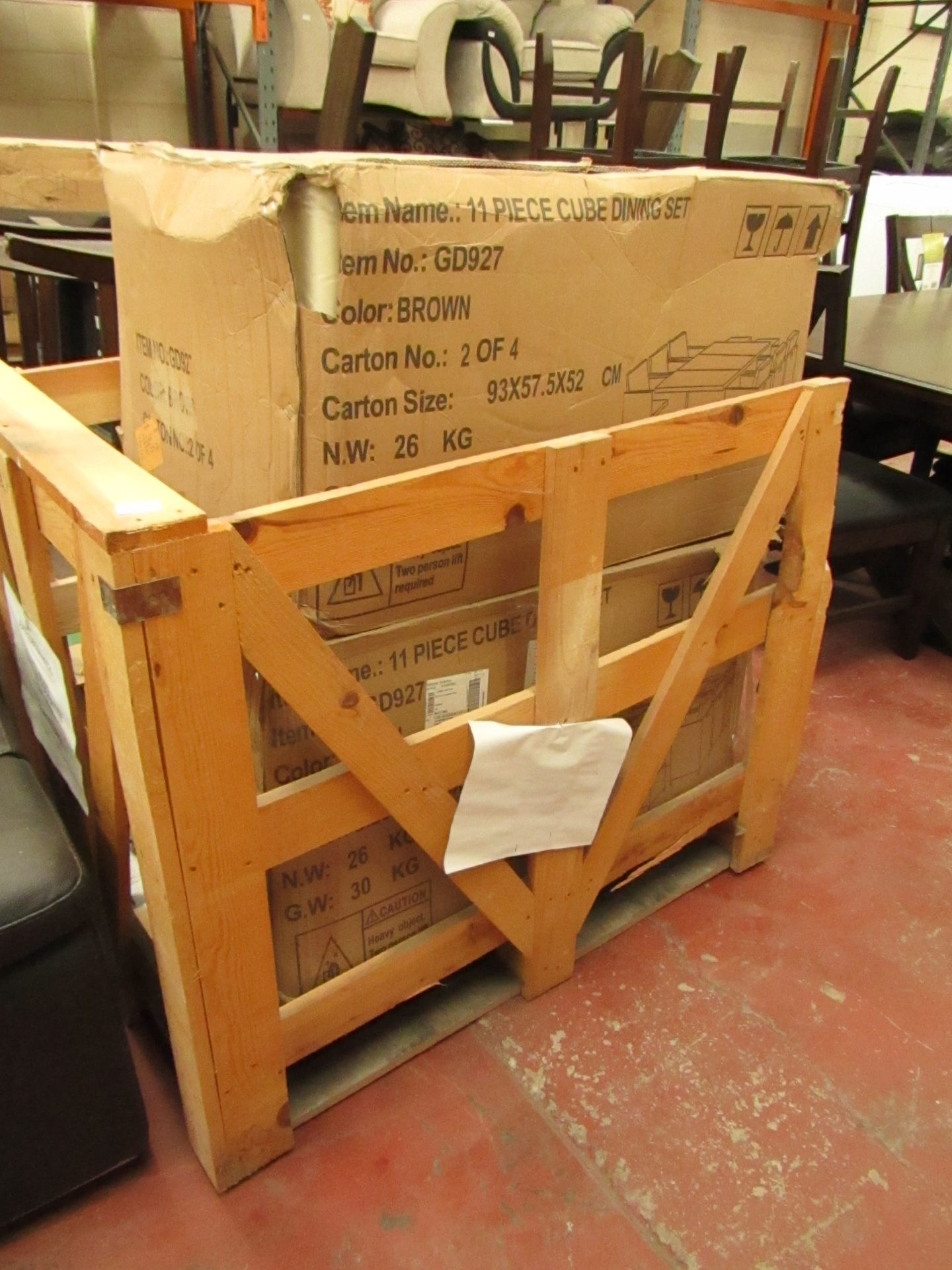 Pallet containing 2 pack 2 of 4 boxes from a brown rattan 11 piece Cube Dining sets, both