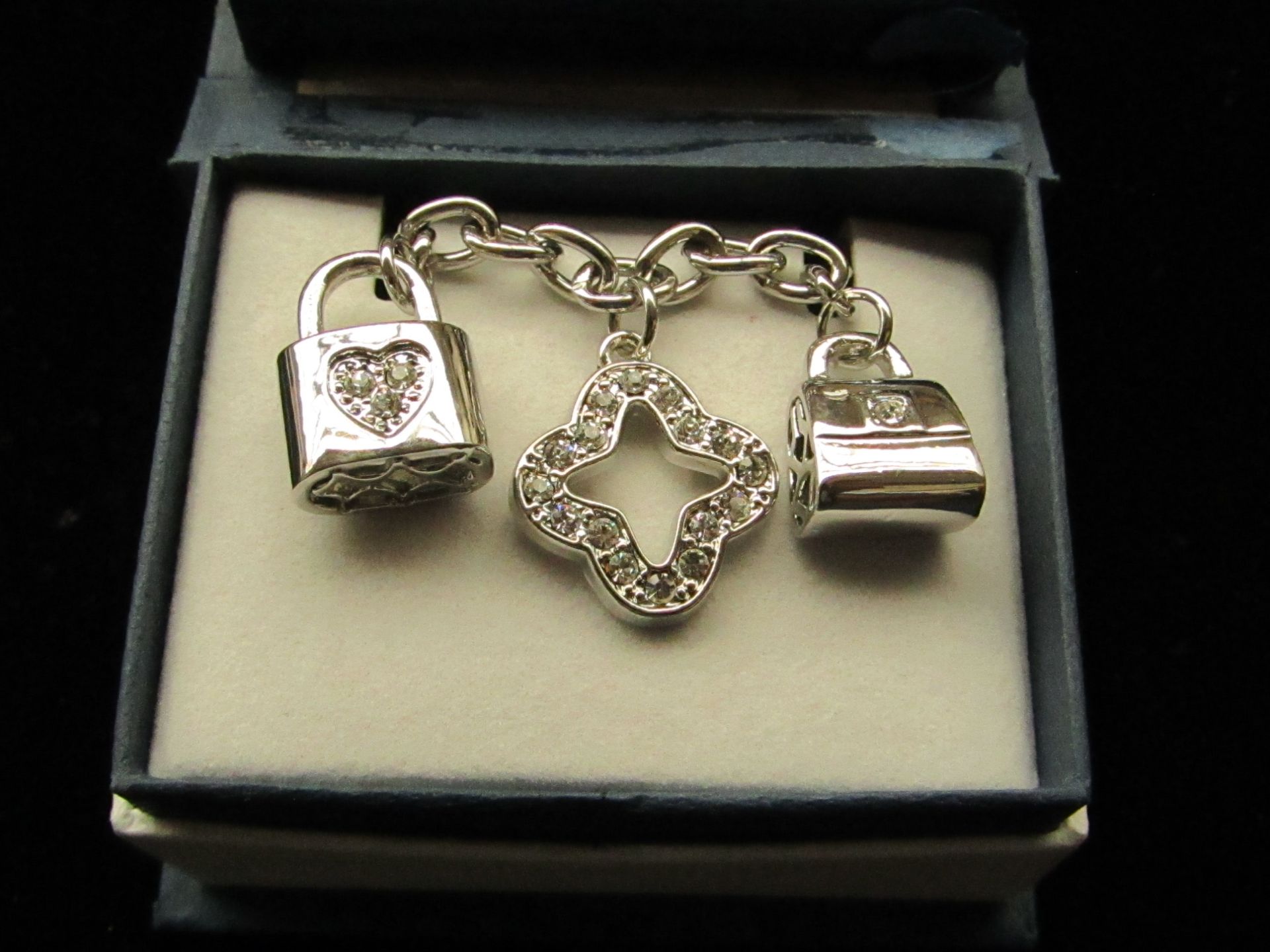 3x Carlo Charm bracelets each with 7 charms, new and boxed.