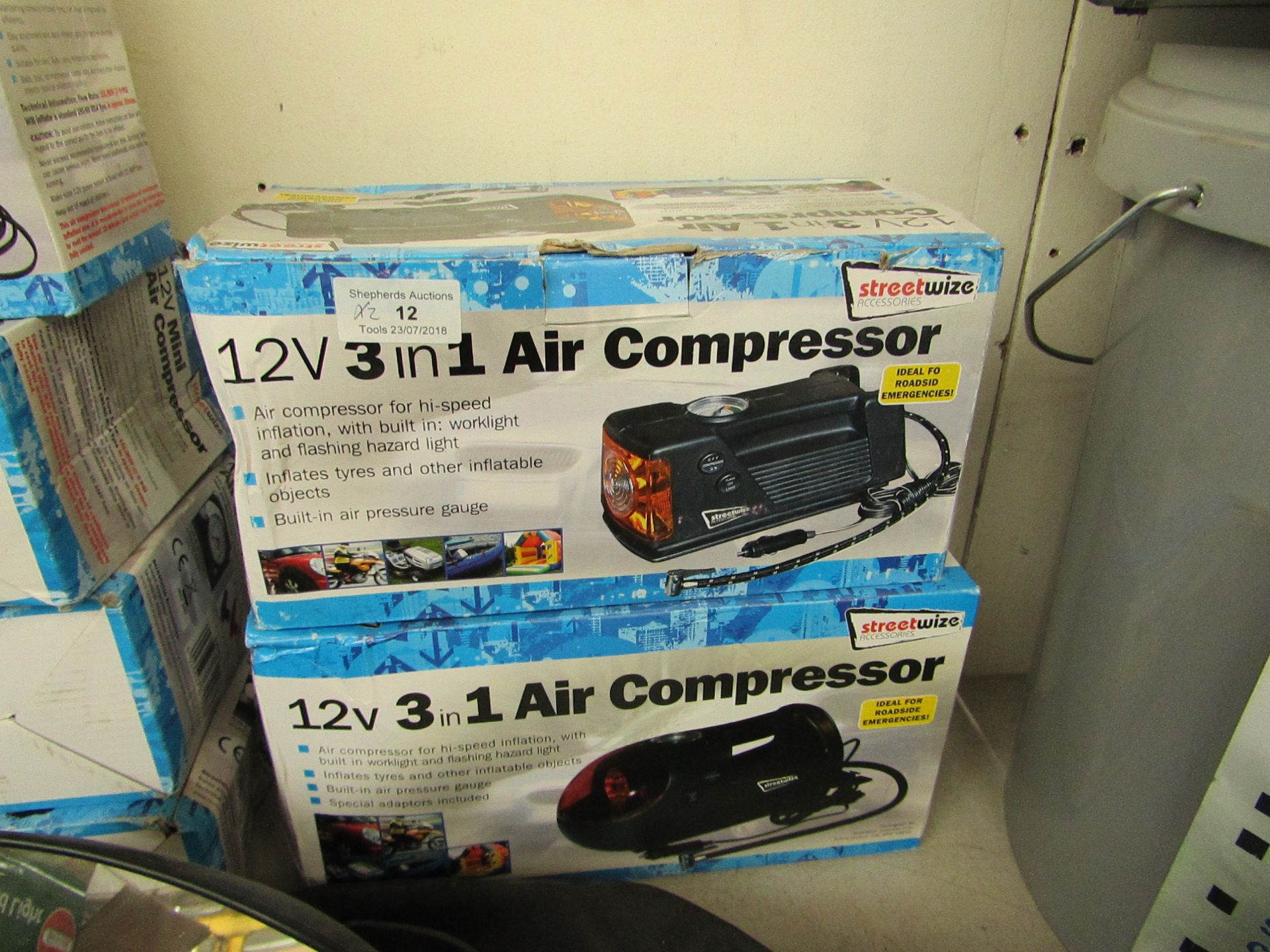 2x varied design Streetwize 12v 3 in 1 air compressor, both boxed and unchecked