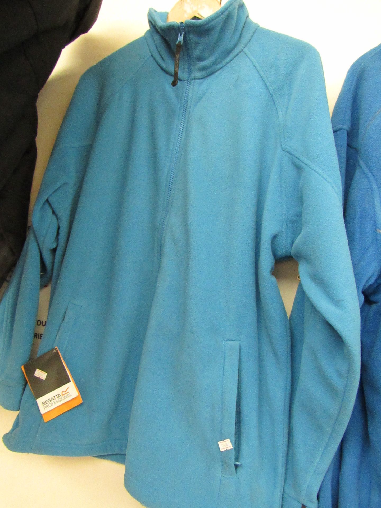 Regatta Fleece Blue ( full front zip with zipped pockets ) size L new in packaging