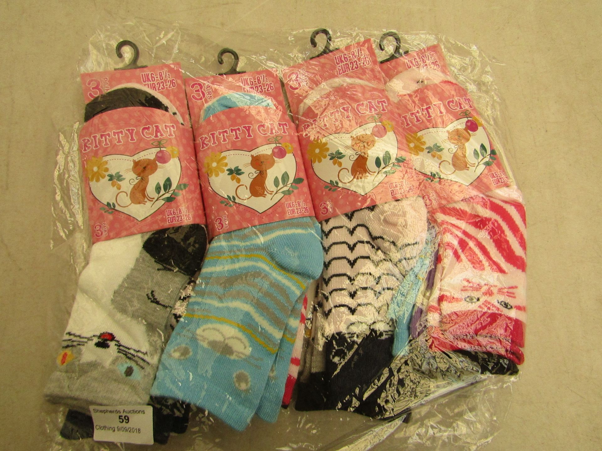 12 X Pairs of childrens socks kitty cat themed size 6-8 1/2 all new in packaging