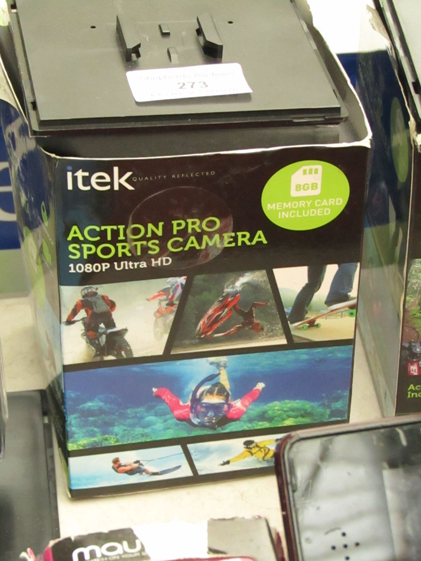 Itek action Pro sports camera, untested with accessories and box.