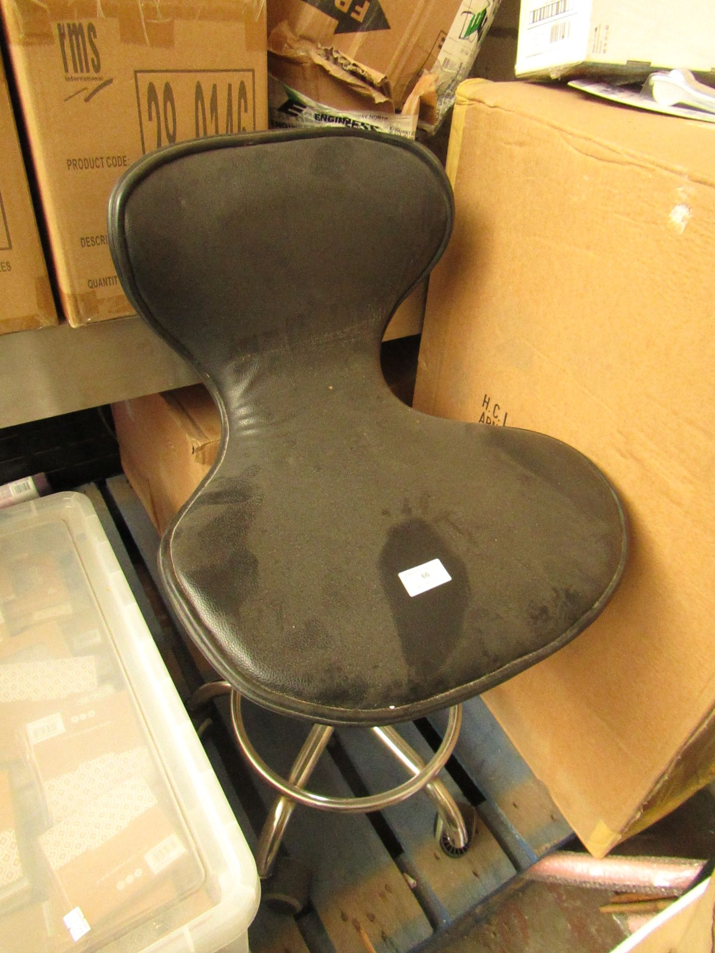 Black colour work stool with backrest. Item has been previously used.