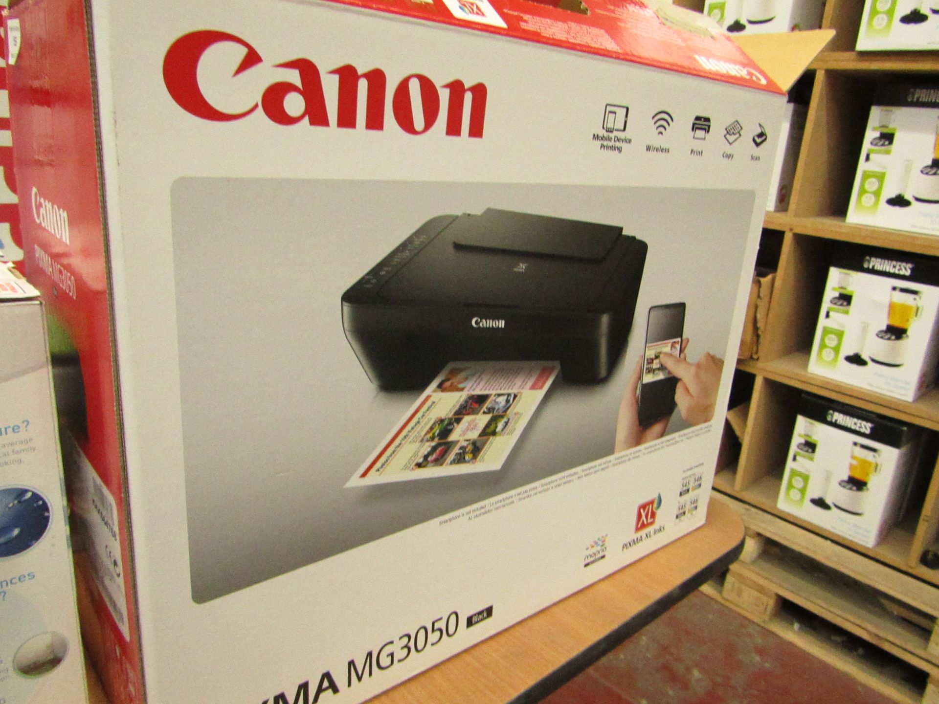 Canon Pixma MG3050 printer, powers on and boxed.